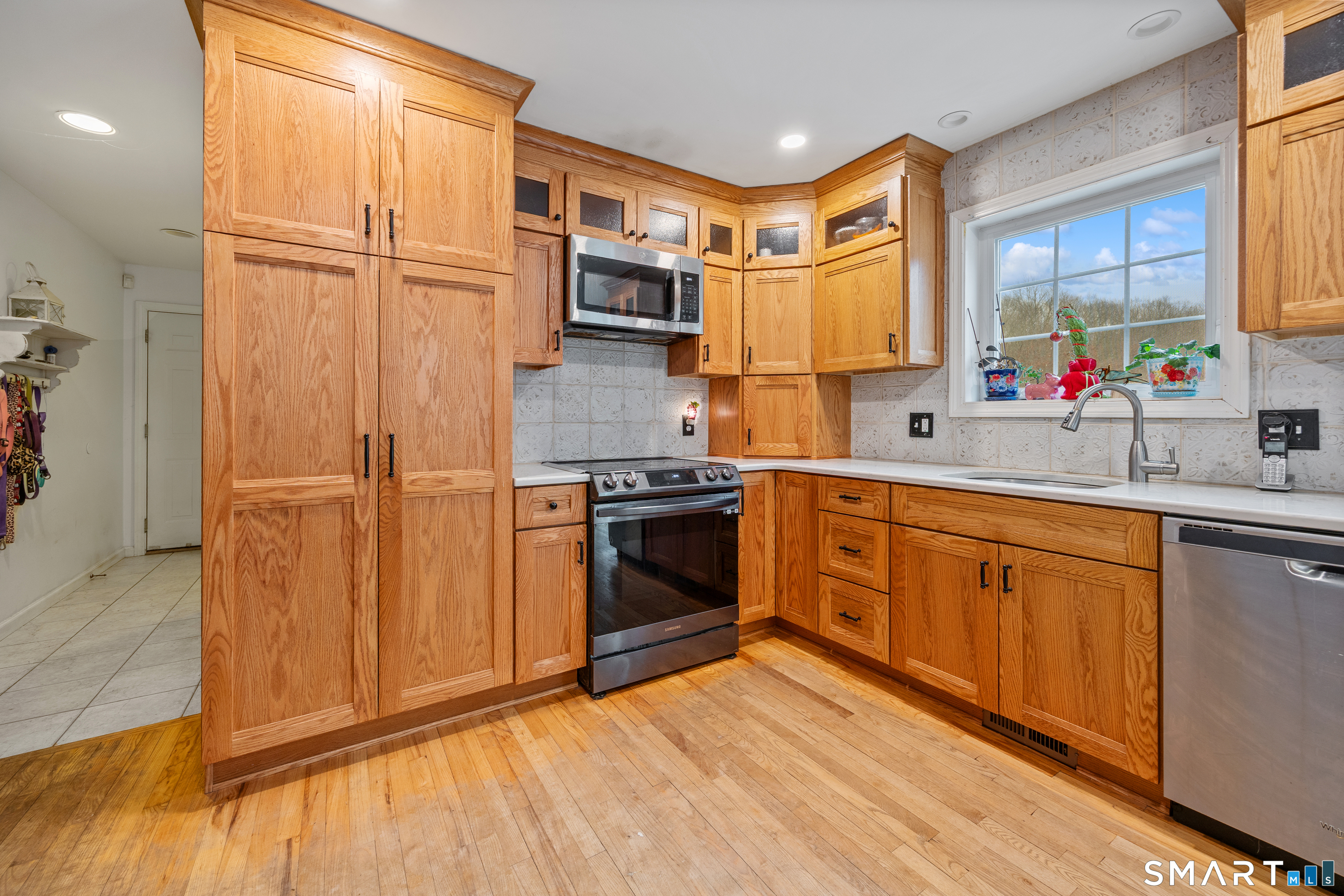 197 Preston Road Plymouth, CT 06786 - Photo 8 of 39 a kitchen with stainless steel appliances granite countertop a refrigerator sink and wooden cabinets