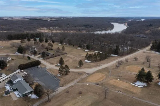 an aerial view of a residential houses with outdoor space