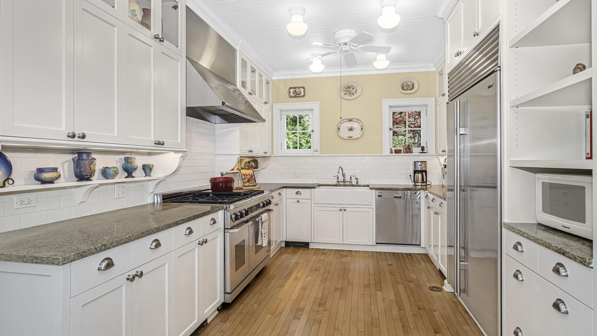 719 Milburn Street Evanston, IL 60201 - Photo 12 of 35 a kitchen with a sink stove and cabinets