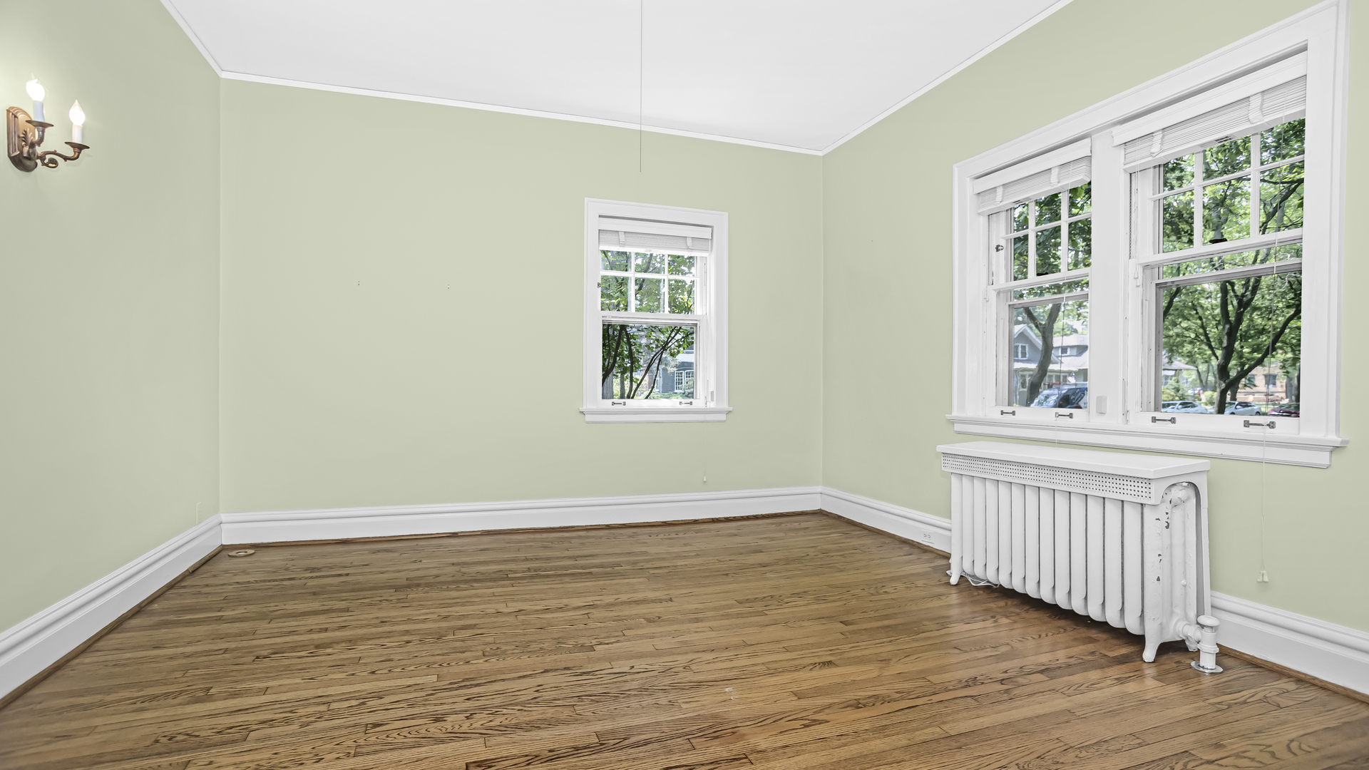 719 Milburn Street Evanston, IL 60201 - Photo 19 of 35 a view of an empty room with wooden floor and a window