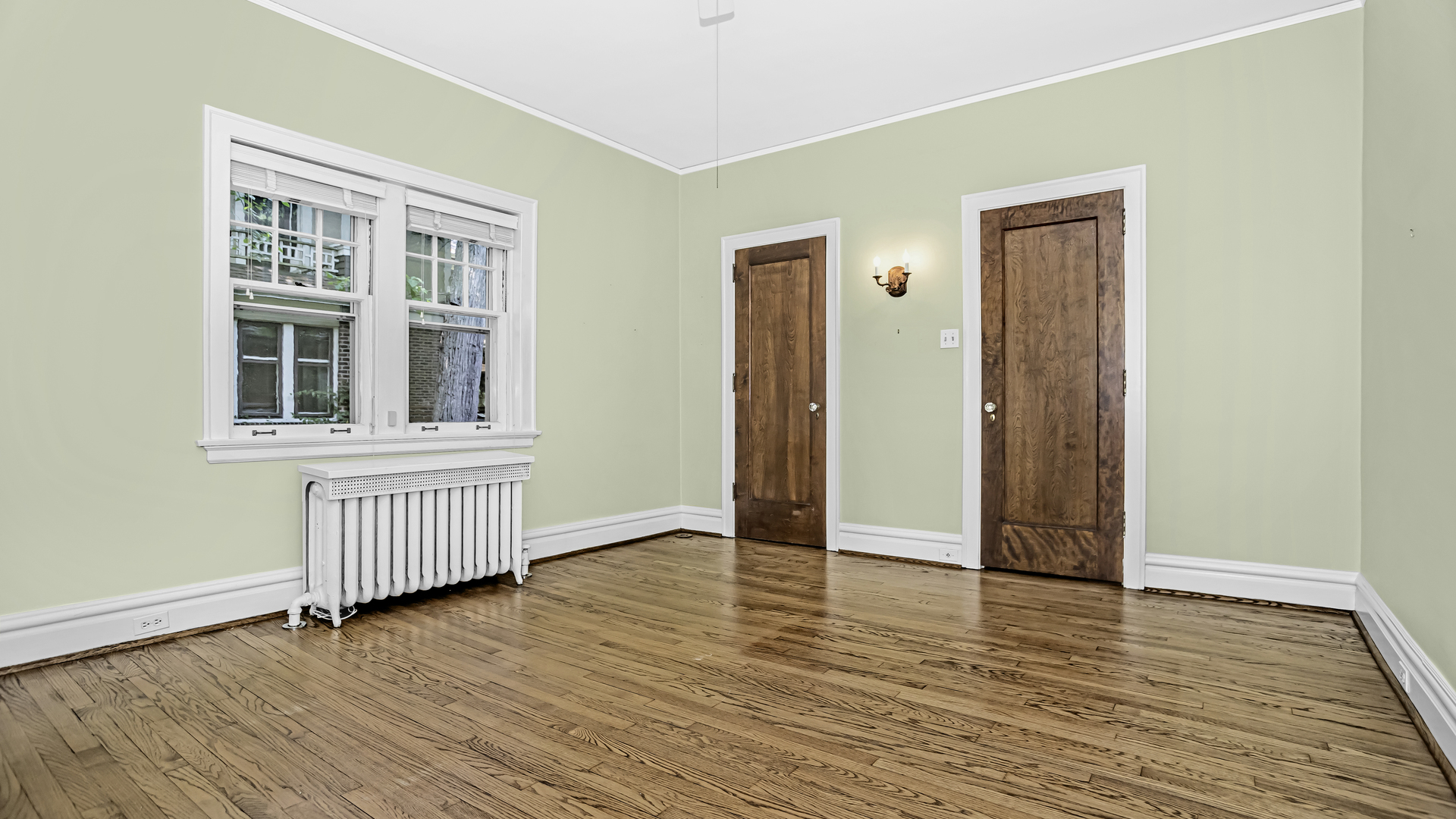 719 Milburn Street Evanston, IL 60201 - Photo 20 of 35 an empty room with wooden floor and windows