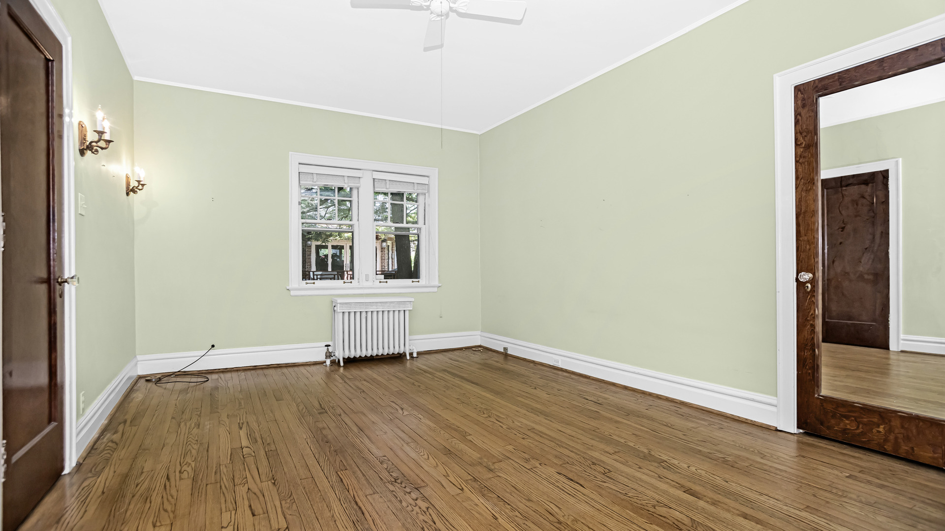 719 Milburn Street Evanston, IL 60201 - Photo 21 of 35 an empty room with wooden floor and windows