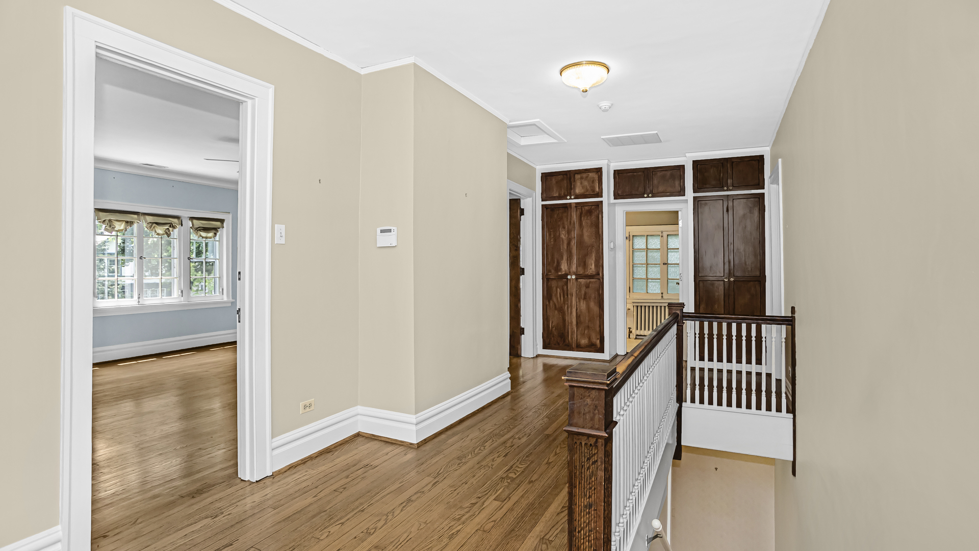 719 Milburn Street Evanston, IL 60201 - Photo 23 of 35 a view of a hallway with wooden floor and a bathroom