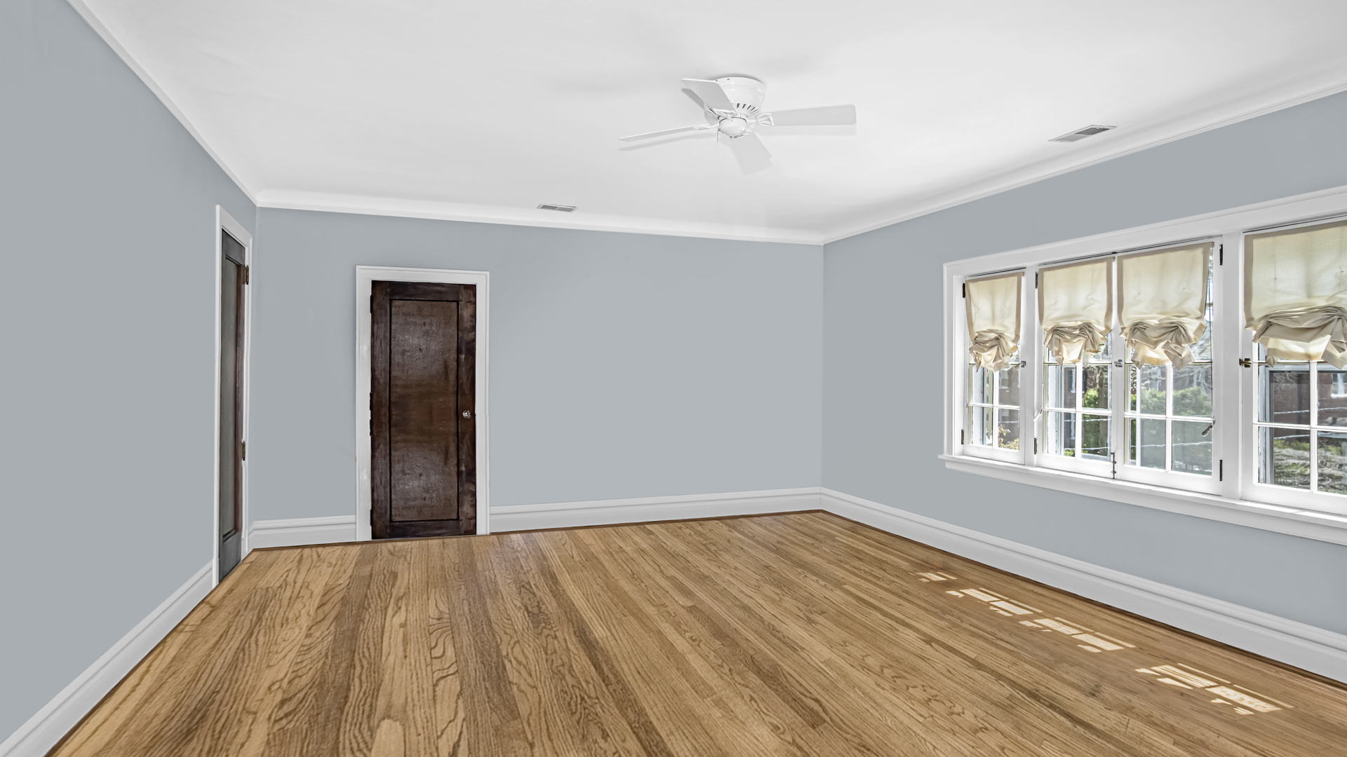 719 Milburn Street Evanston, IL 60201 - Photo 25 of 35 a view of an empty room with wooden floor and a window