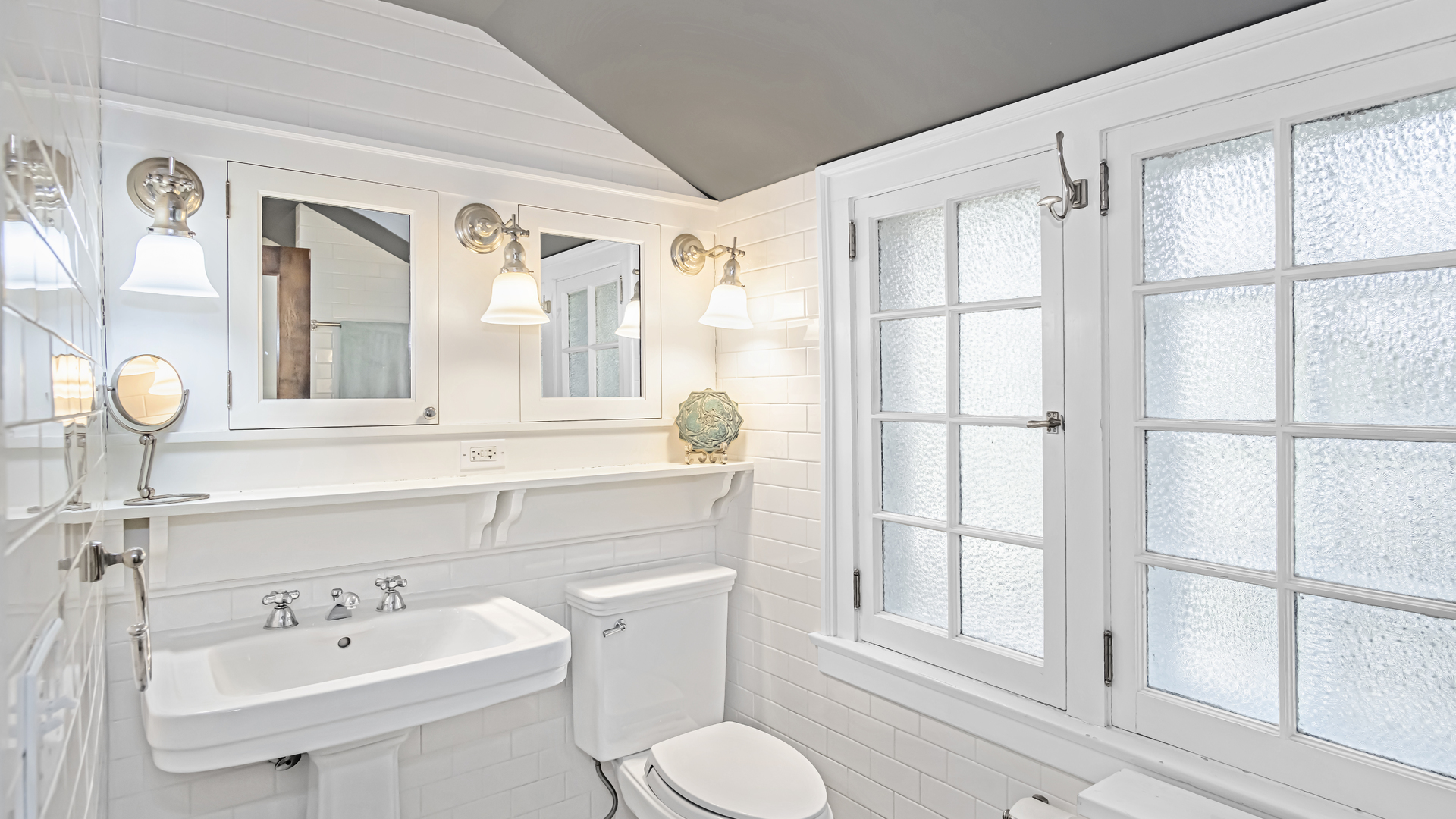 719 Milburn Street Evanston, IL 60201 - Photo 27 of 35 a bathroom with a sink and a mirror