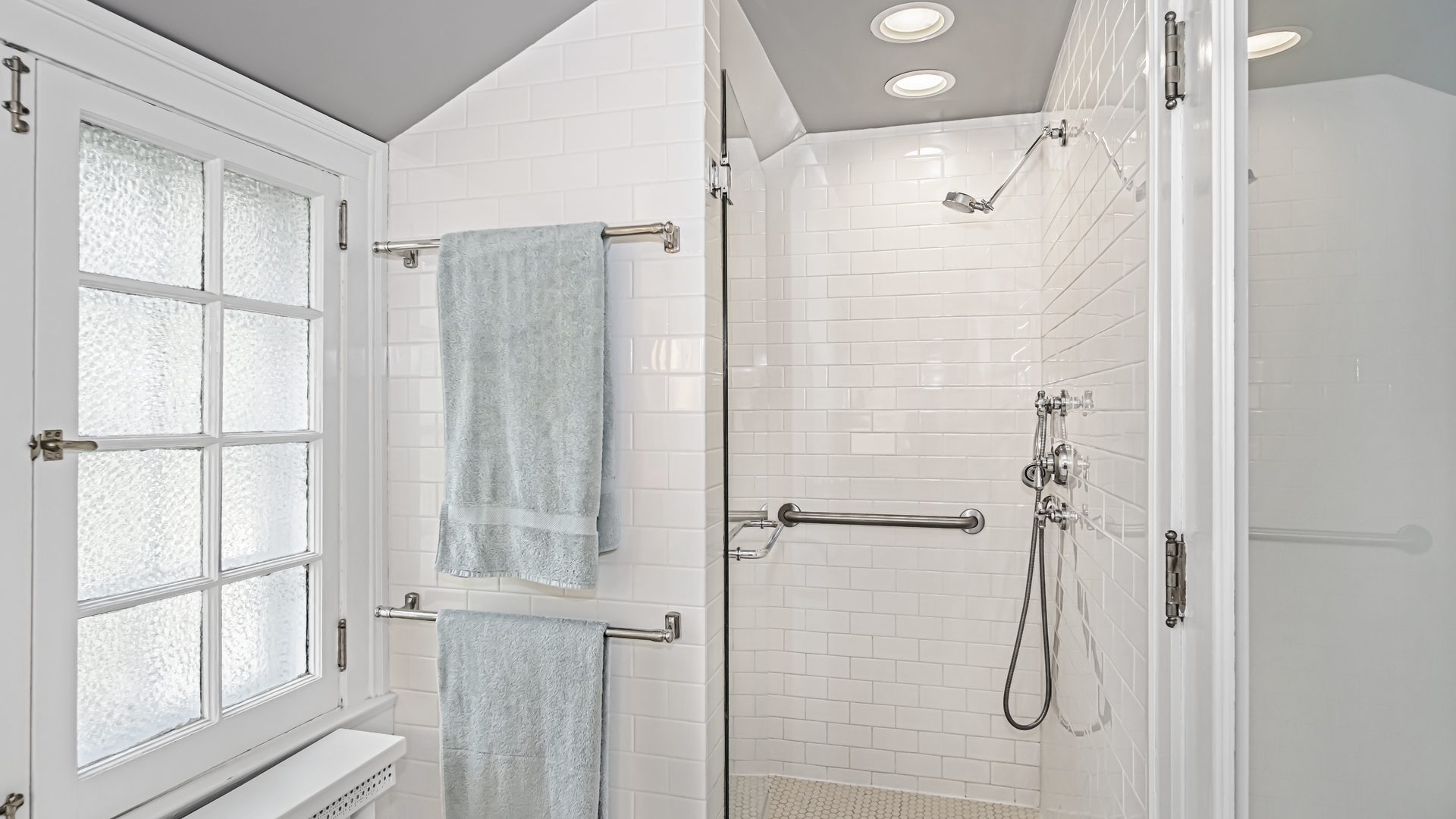 719 Milburn Street Evanston, IL 60201 - Photo 28 of 35 a bathroom with a shower and a window