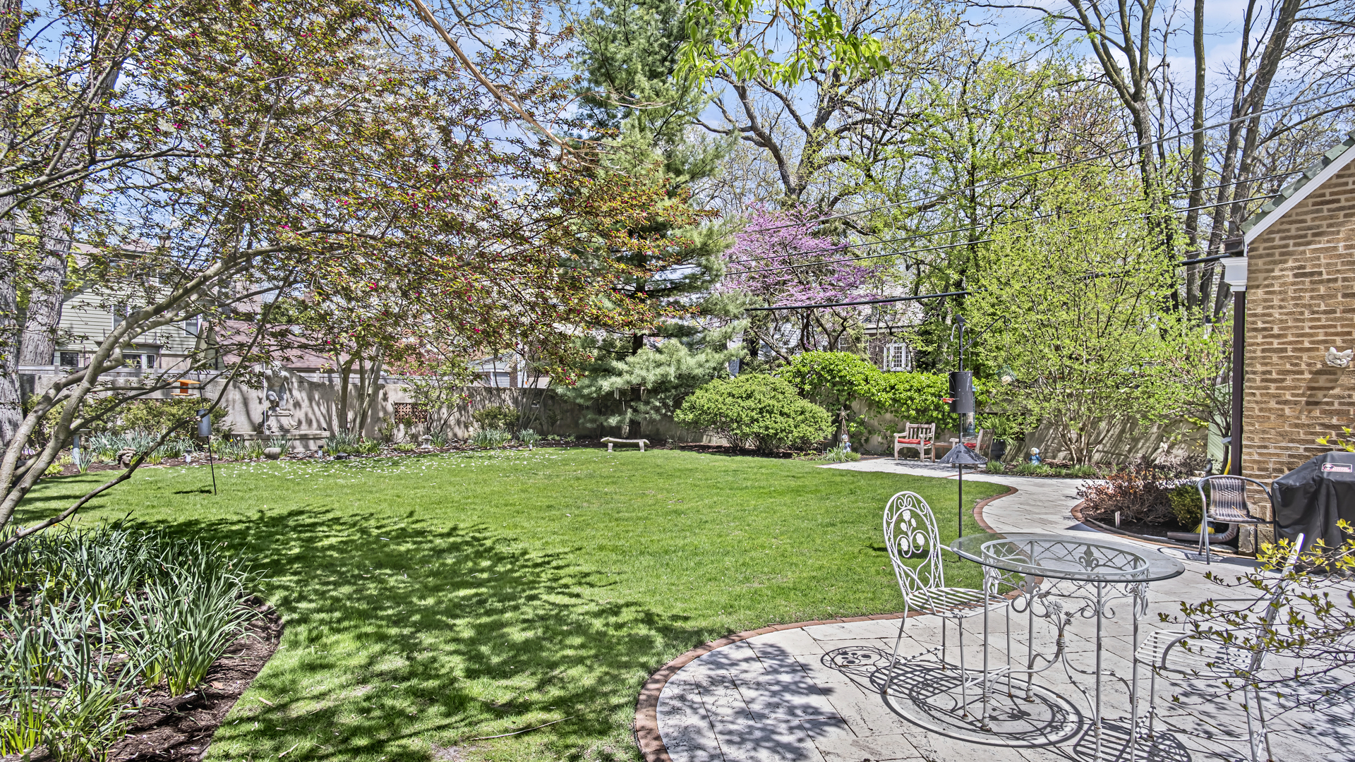 719 Milburn Street Evanston, IL 60201 - Photo 29 of 35 a view of backyard with seating area and green space
