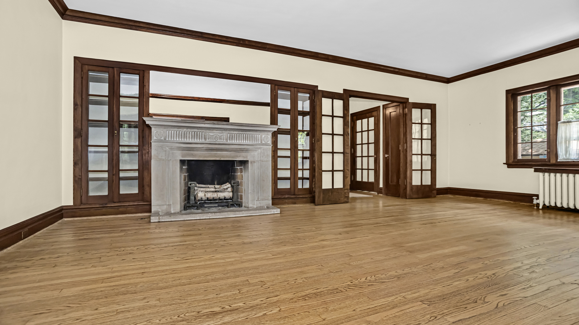 719 Milburn Street Evanston, IL 60201 - Photo 7 of 35 wooden floor fireplace and windows in an empty room