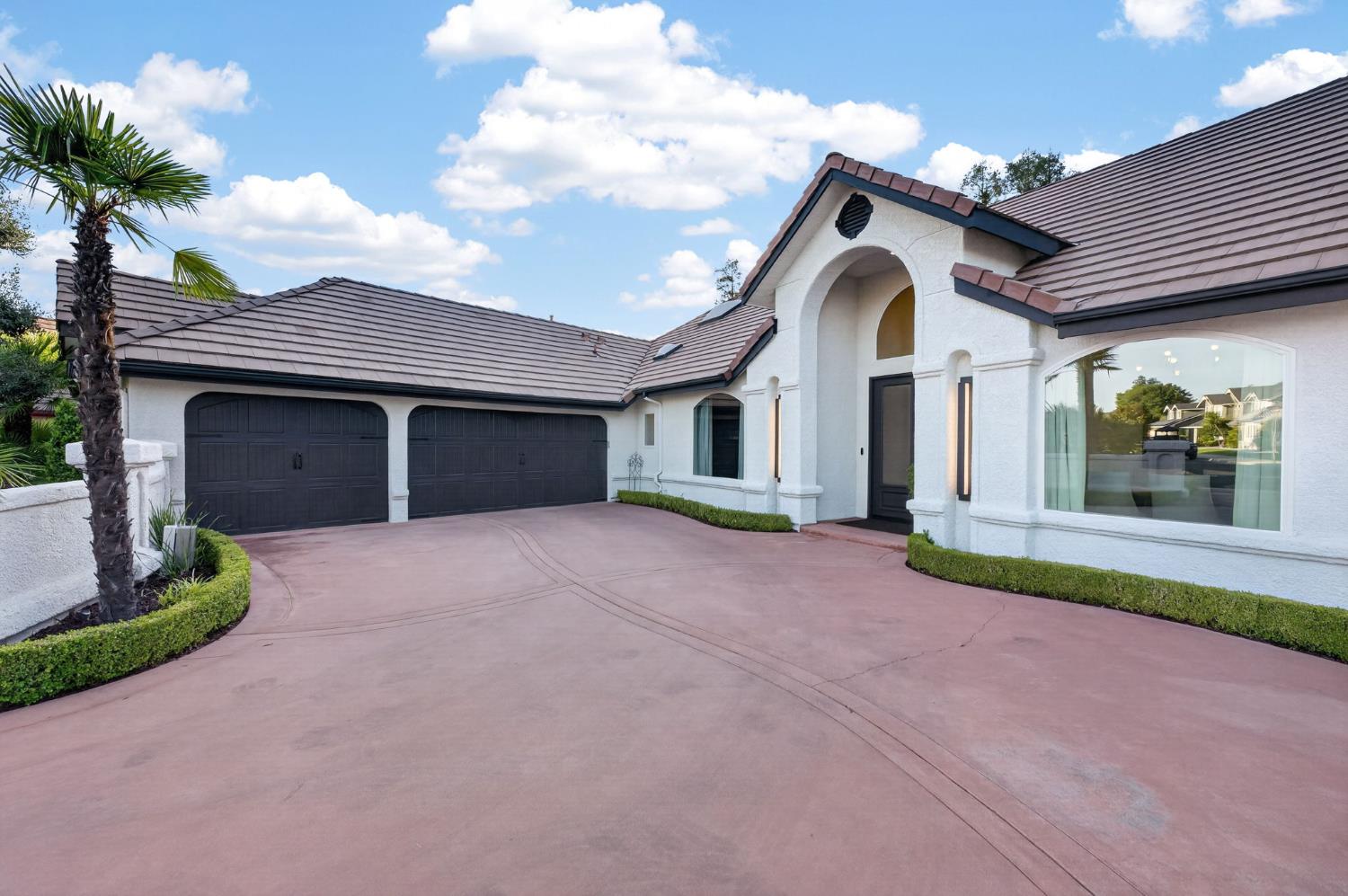 601 Decatur Avenue Clovis, CA 93611 - Photo 5 of 62 a front view of a house with a yard and garage