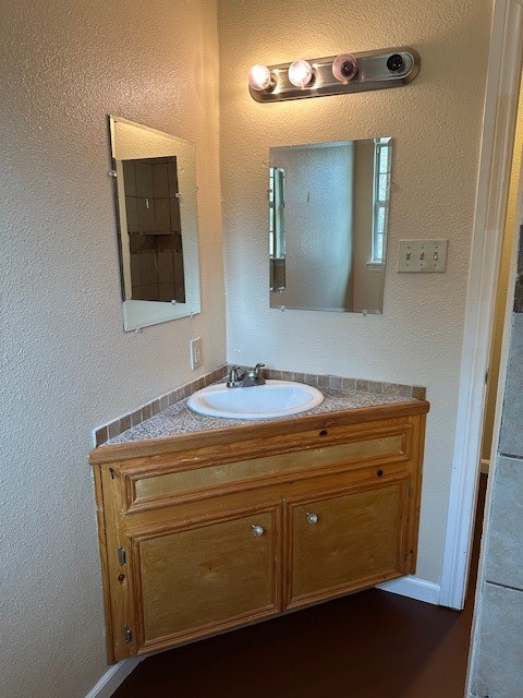 24331 Farm To Market Road 2090 Splendora, TX 77372 - Photo 15 of 38 a bathroom with a sink and a mirror