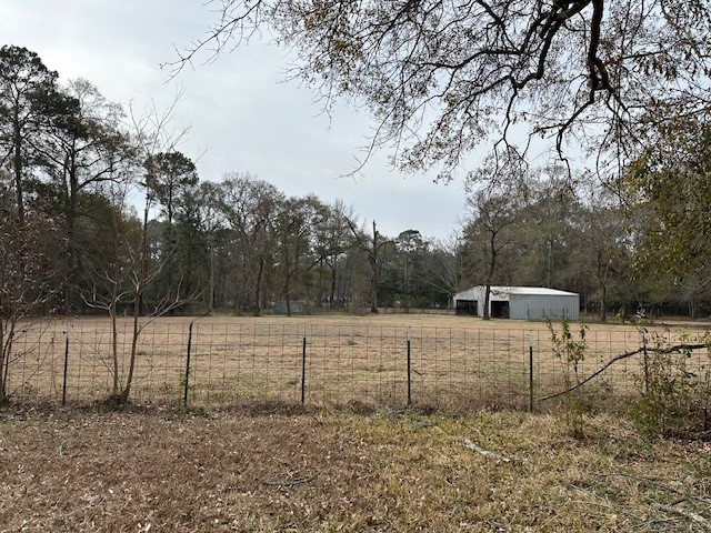 24331 Farm To Market Road 2090 Splendora, TX 77372 - Photo 18 of 38 a view of a backyard