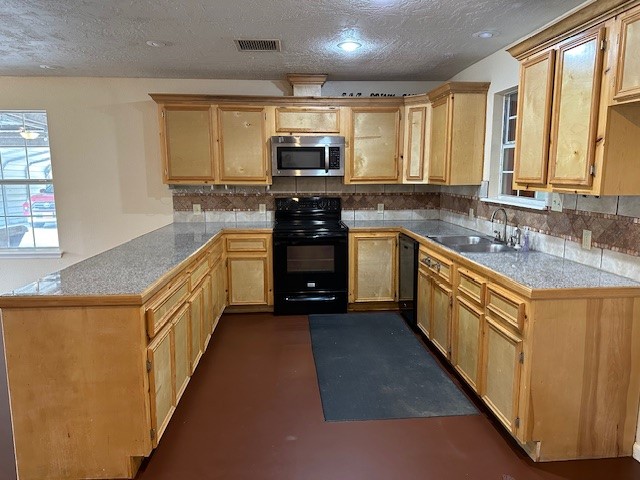 24331 Farm To Market Road 2090 Splendora, TX 77372 - Photo 2 of 38 a large kitchen with stainless steel appliances granite countertop a stove a sink and a microwave