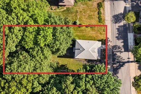 an aerial view of a houses and roads