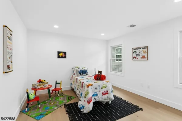 a bed room with furniture and a window