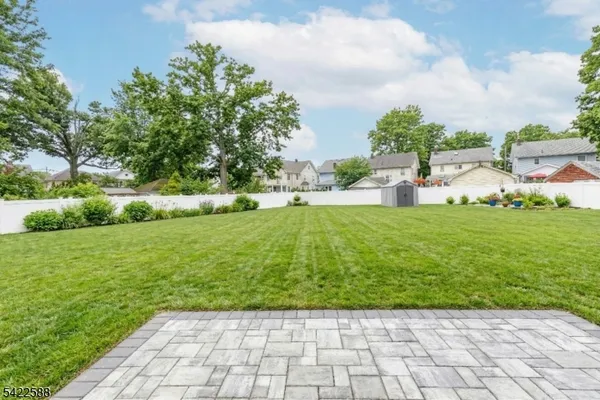 a view of a garden with lawn chairs