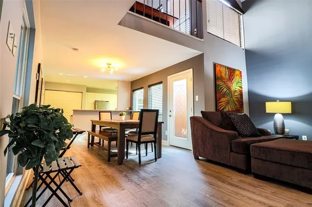 a kitchen with granite countertop a sink a counter top space stainless steel appliances and cabinets