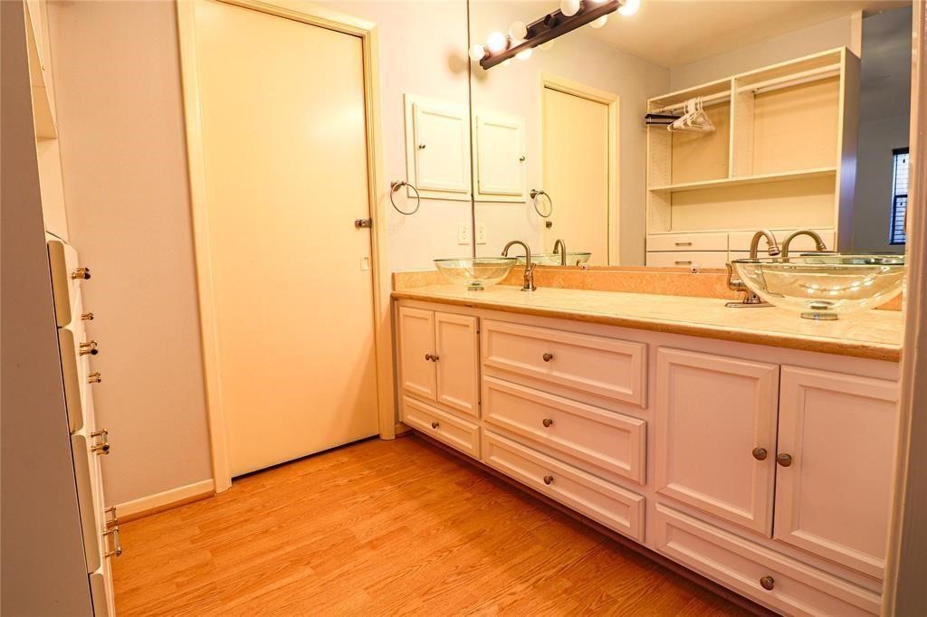 4724 Post Oak Timber Drive, Unit 8/65 Houston, TX 77056 - Photo 16 of 21 a bathroom with a granite countertop sink and a mirror