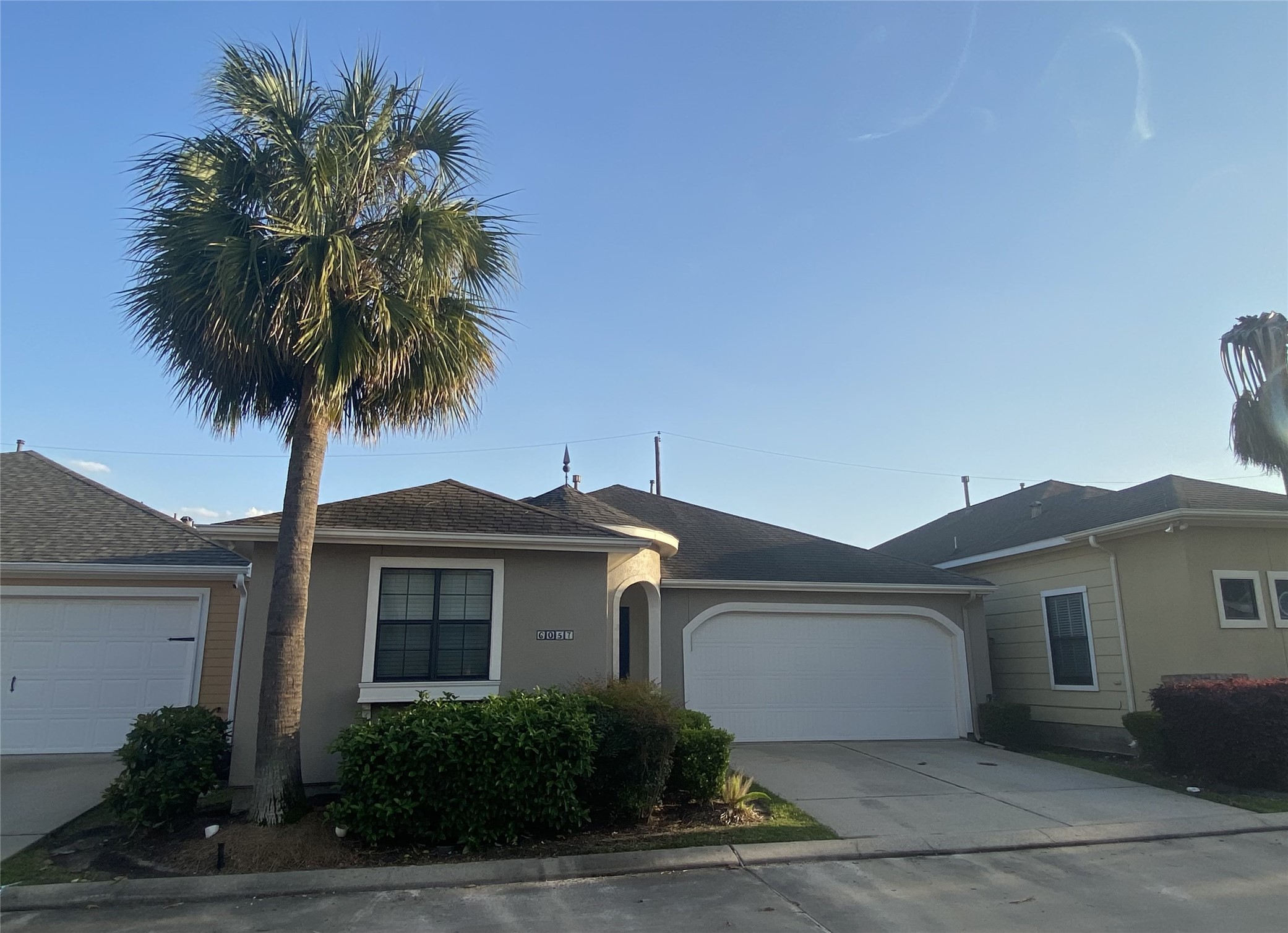 6057 Yale Street Houston, TX 77076 - Photo 3 of 49 a front view of a house with a yard and garage