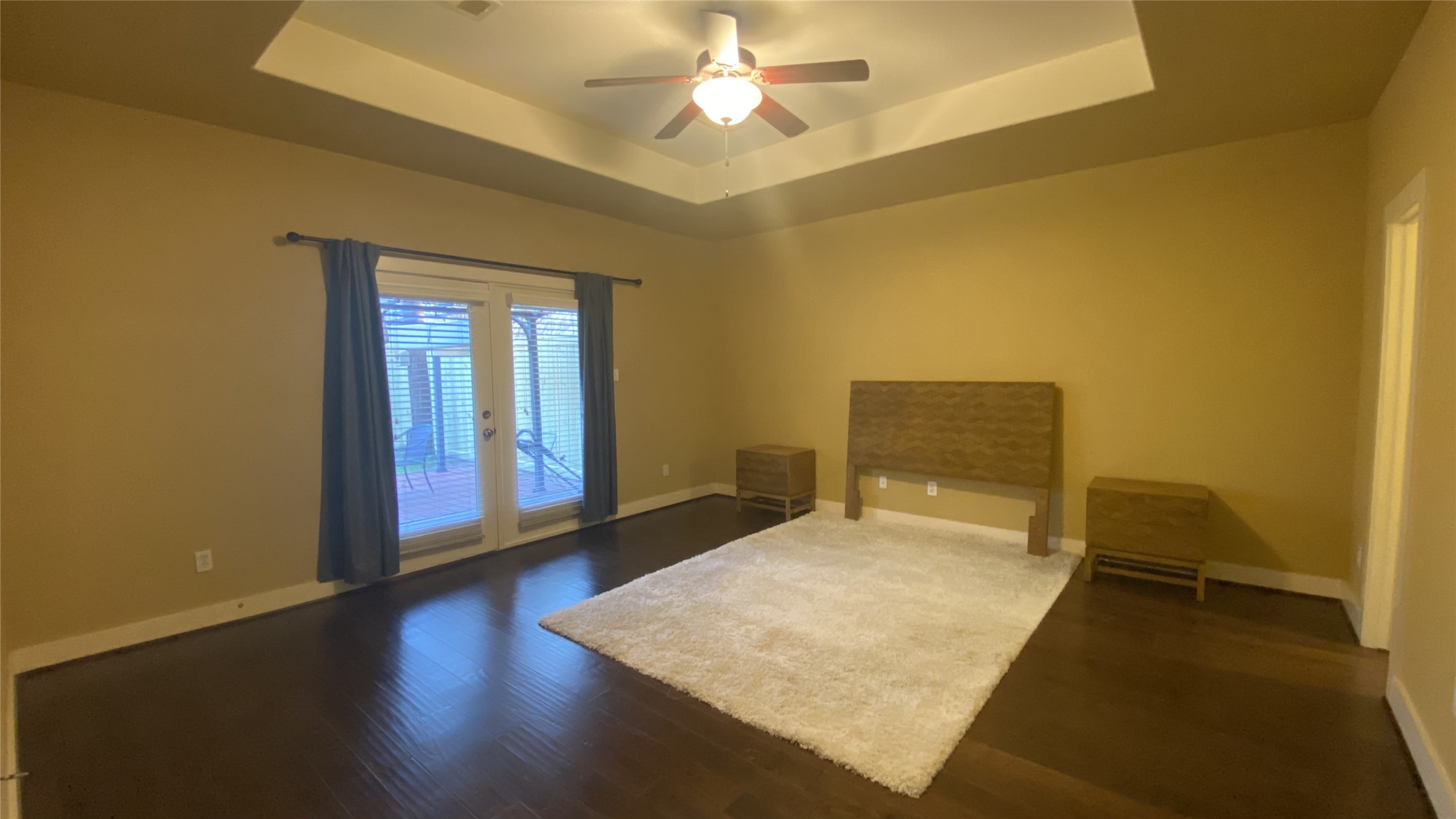 6057 Yale Street Houston, TX 77076 - Photo 31 of 49 a bedroom with a bed and a chandelier