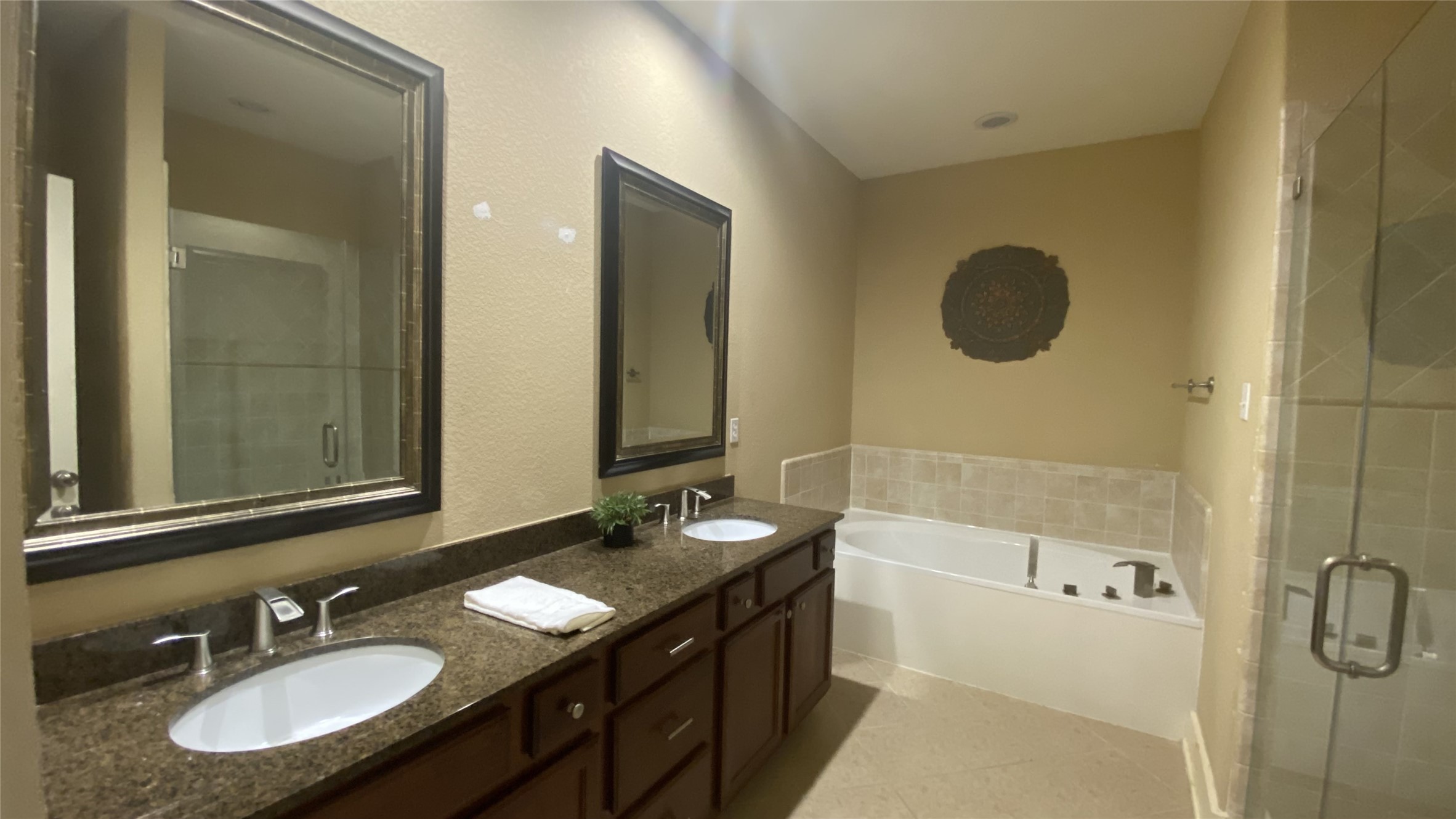 6057 Yale Street Houston, TX 77076 - Photo 36 of 49 a bathroom with a granite countertop sink and a mirror
