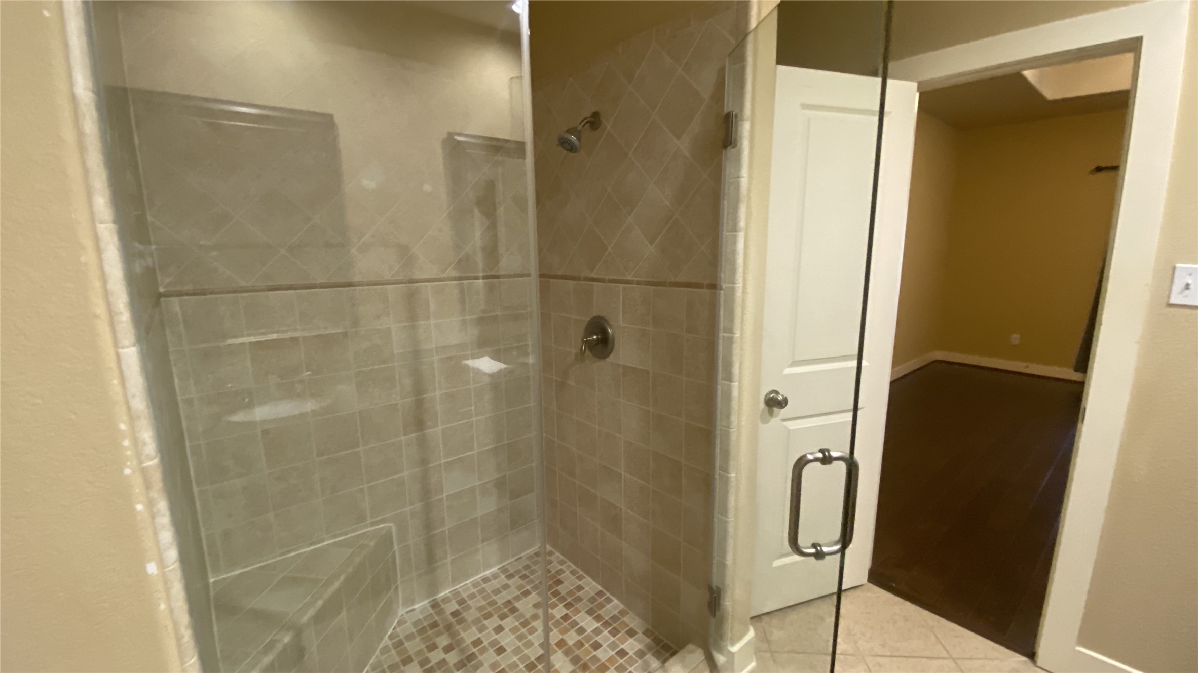 6057 Yale Street Houston, TX 77076 - Photo 38 of 49 a bathroom with a shower and a glass door