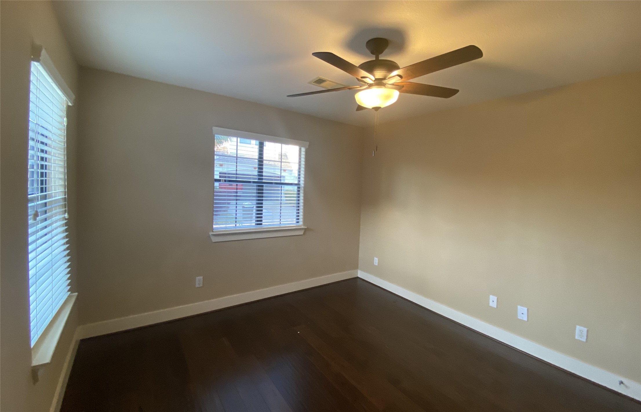6057 Yale Street Houston, TX 77076 - Photo 40 of 49 a view of an empty room with wooden floor and a window