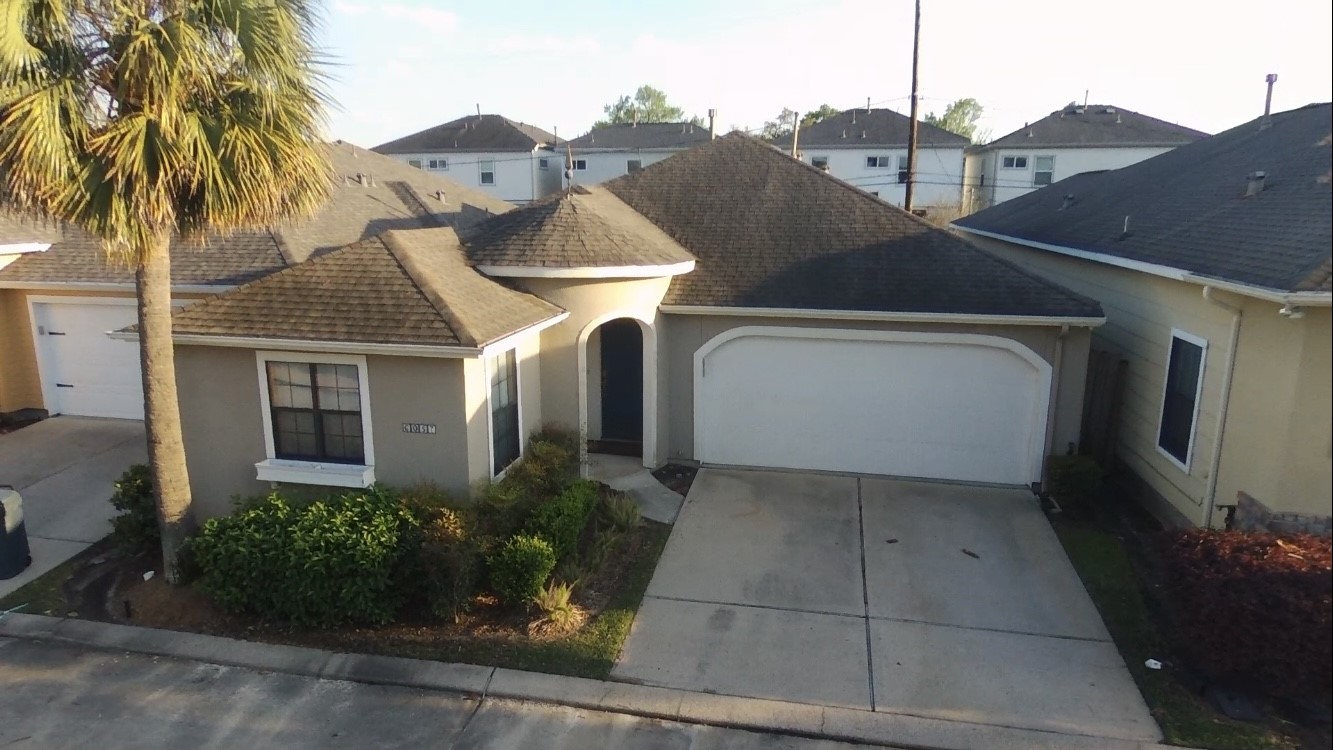 6057 Yale Street Houston, TX 77076 - Photo 4 of 49 a front view of a house with garden