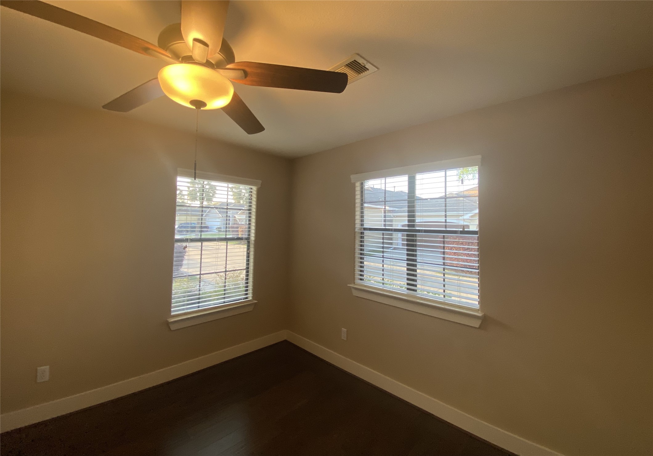 6057 Yale Street Houston, TX 77076 - Photo 41 of 49 a view of an empty room with wooden floor and a window
