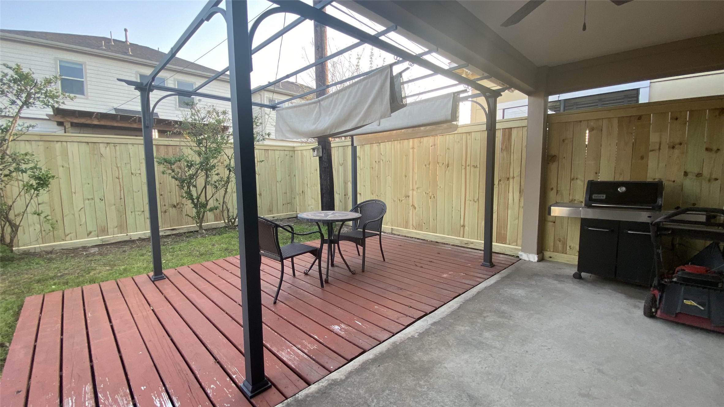 6057 Yale Street Houston, TX 77076 - Photo 44 of 49 a view of a patio with a table and chairs