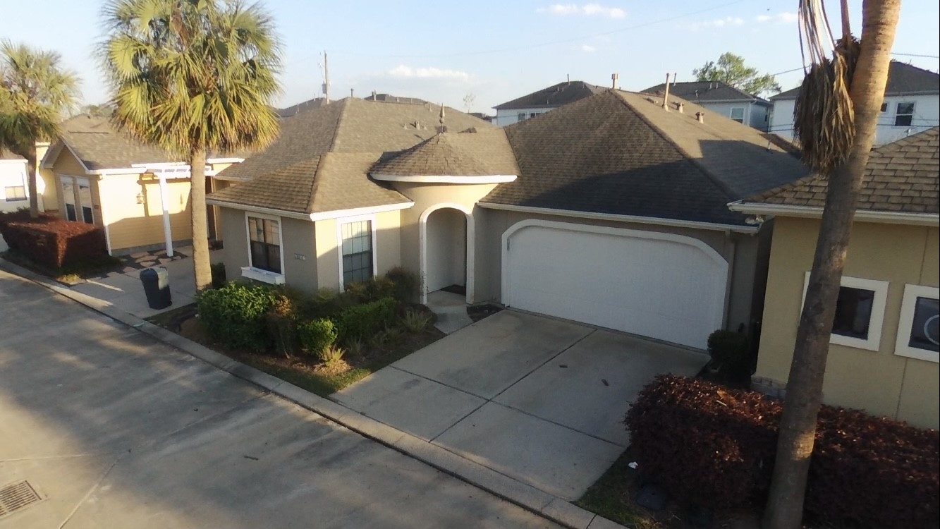 6057 Yale Street Houston, TX 77076 - Photo 5 of 49 a front view of a house with garden