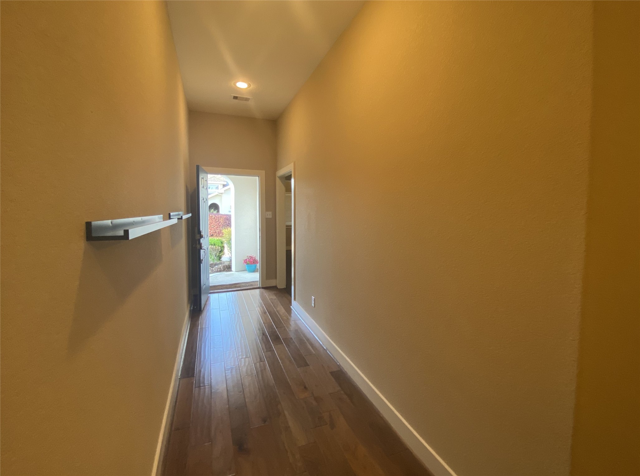 6057 Yale Street Houston, TX 77076 - Photo 9 of 49 a view of a hallway with wooden floor