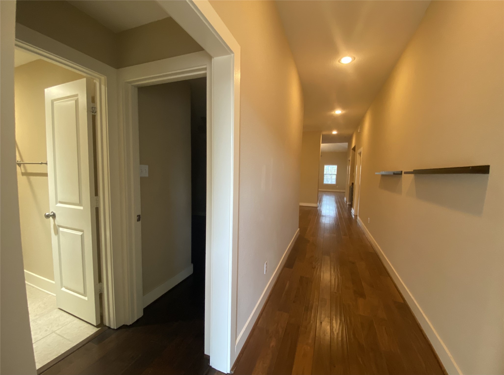 6057 Yale Street Houston, TX 77076 - Photo 10 of 49 a view of a hallway with wooden floor