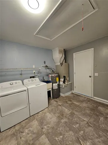 a utility room with dryer and washer