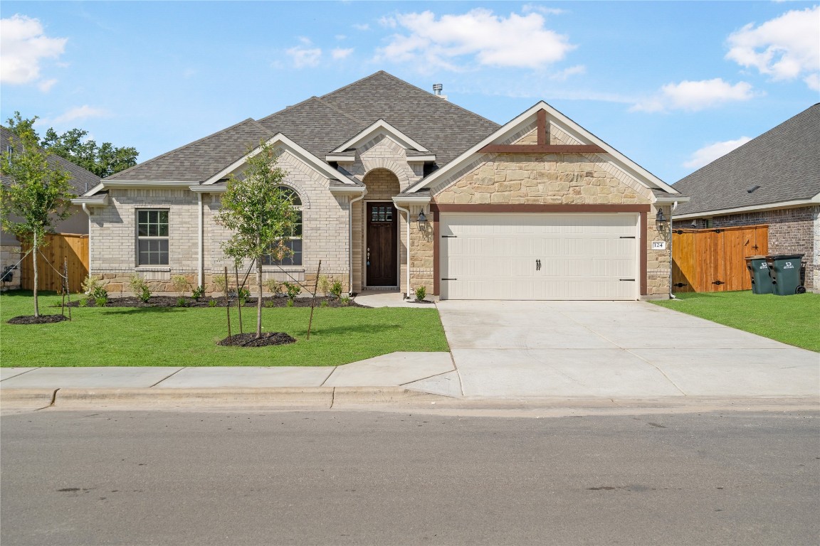 124 Red Granite Road Georgetown, TX 78633 - Photo 1 of 1 front view of house with a yard