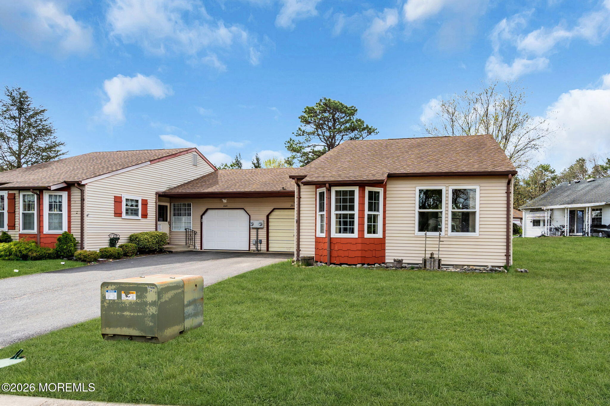 20B Amesbury Road, Unit B Whiting, NJ 08759 - Photo 24 of 25 a front view of a house with a yard and garage