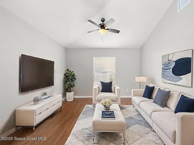 a kitchen with stainless steel appliances a stove a sink cabinets and a dining table