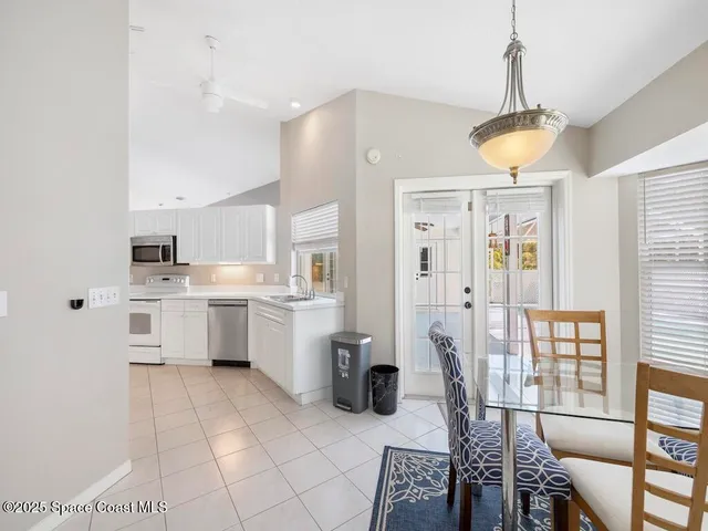 a kitchen with a sink appliances and cabinets