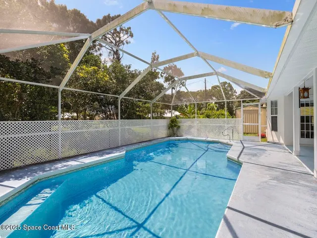 a kitchen with cabinets and steel appliances