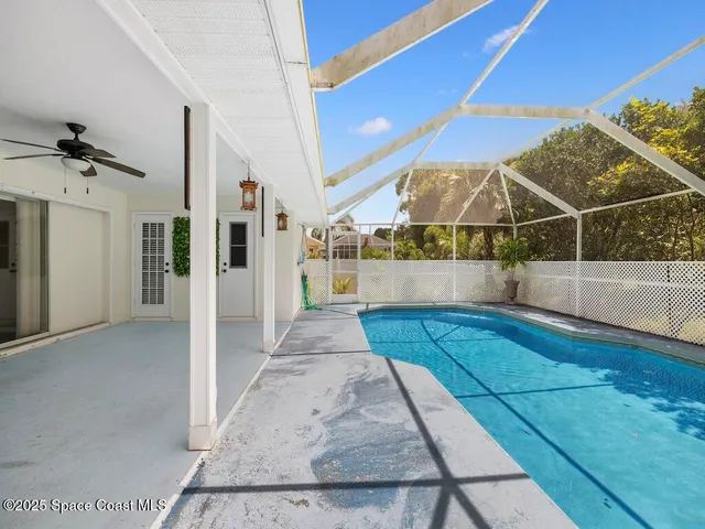 a view of a garden with a swimming pool