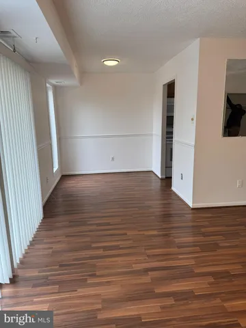 a view of a livingroom with wooden floor