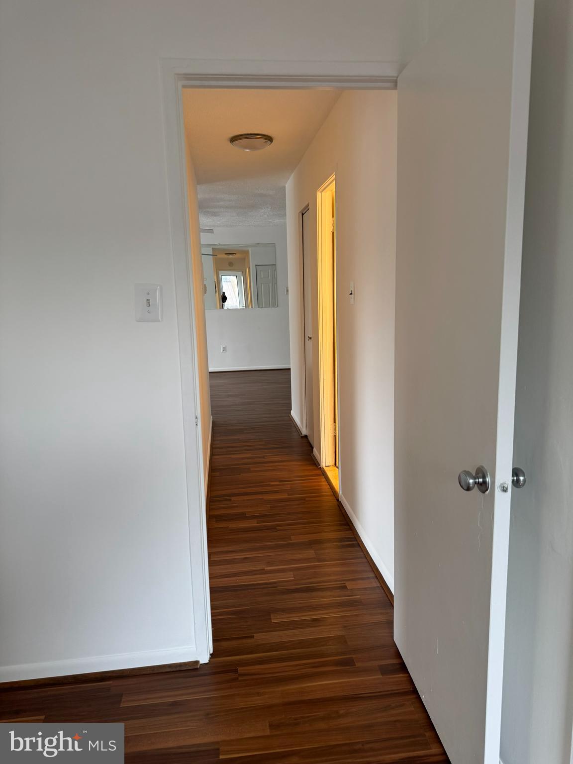 7597 Gales Court, Unit 7A 202 Manassas, VA 20109 - Photo 5 of 16 a view of a hallway with wooden floor