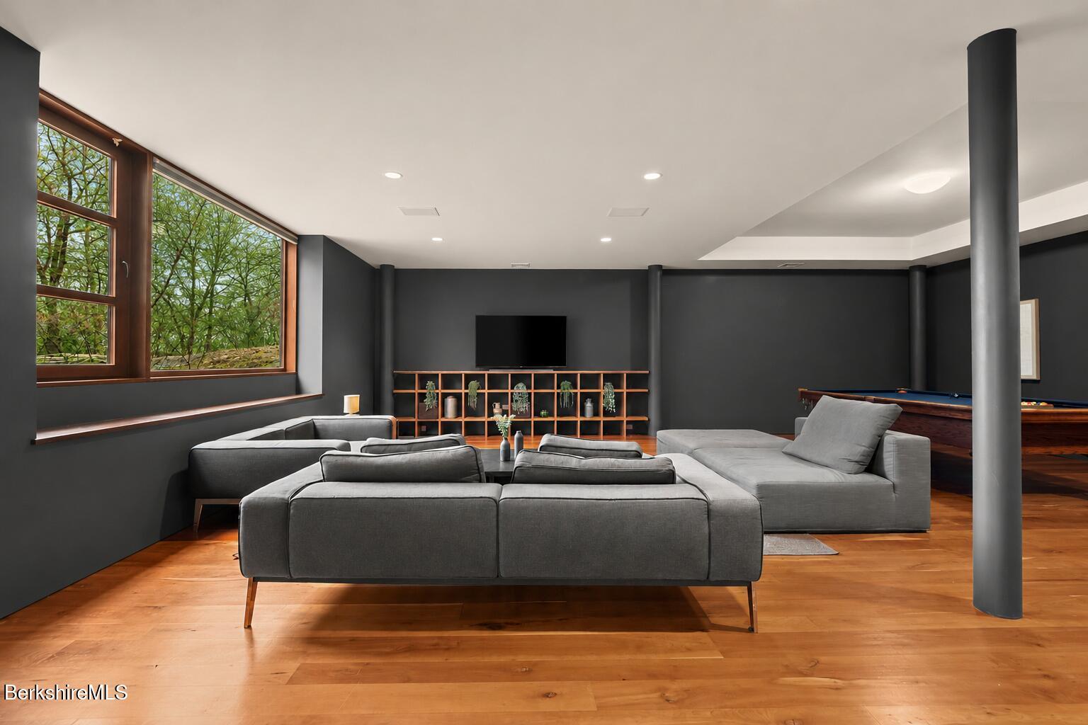 250 Long Pond Road Great Barrington, MA 01230 - Photo 34 of 56 a living room with furniture and a flat screen tv