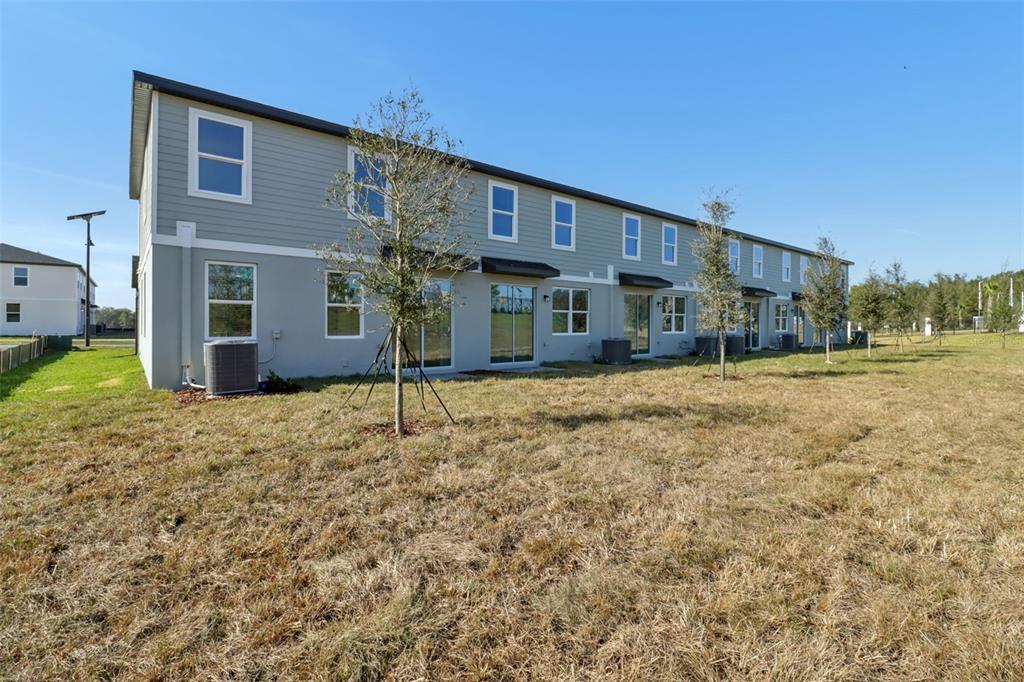 721 Spartina Street Lady Lake, FL 32159 - Photo 32 of 32 a house view with a outdoor space