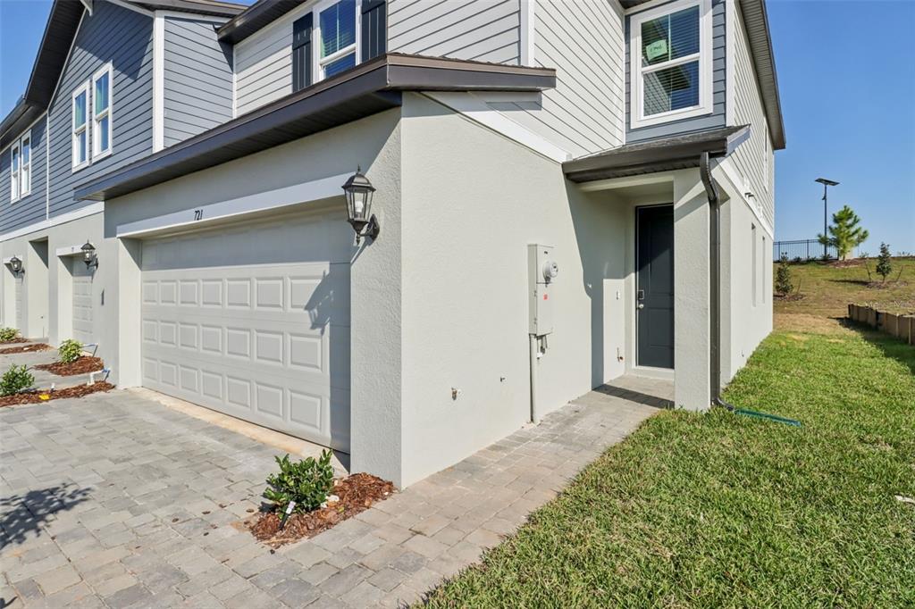 721 Spartina Street Lady Lake, FL 32159 - Photo 4 of 32 a front view of a house with a yard