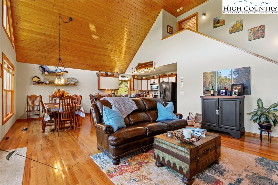 195 Omerta Lane Boone, NC 28607 - Photo 20 of 50 a living room with furniture and wooden floor