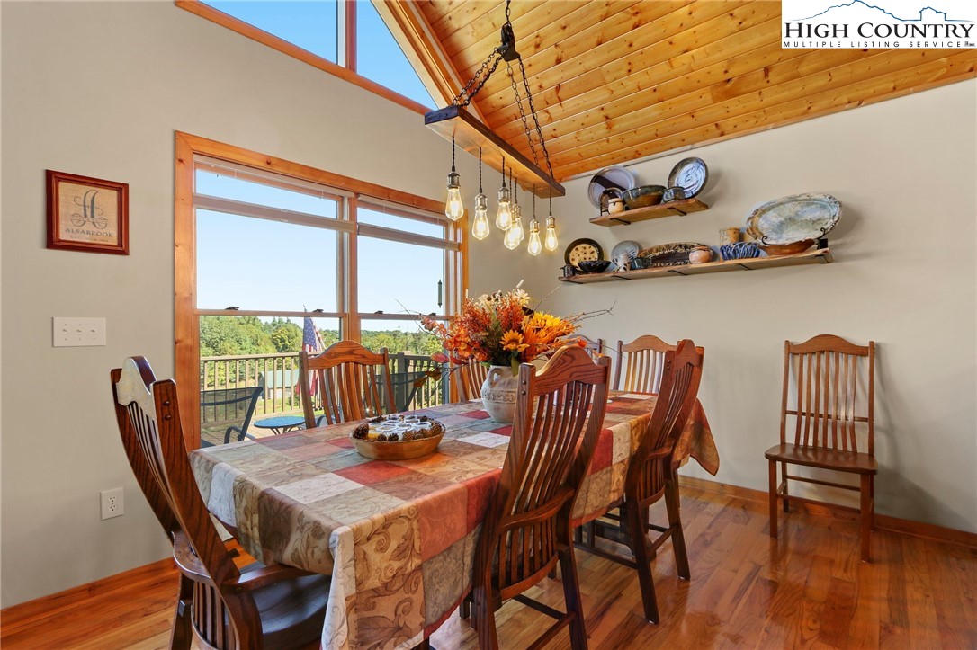 195 Omerta Lane Boone, NC 28607 - Photo 21 of 50 a view of a dining room with furniture window and wooden floor