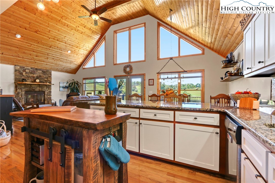 195 Omerta Lane Boone, NC 28607 - Photo 25 of 50 a kitchen with stainless steel appliances granite countertop a sink and cabinets