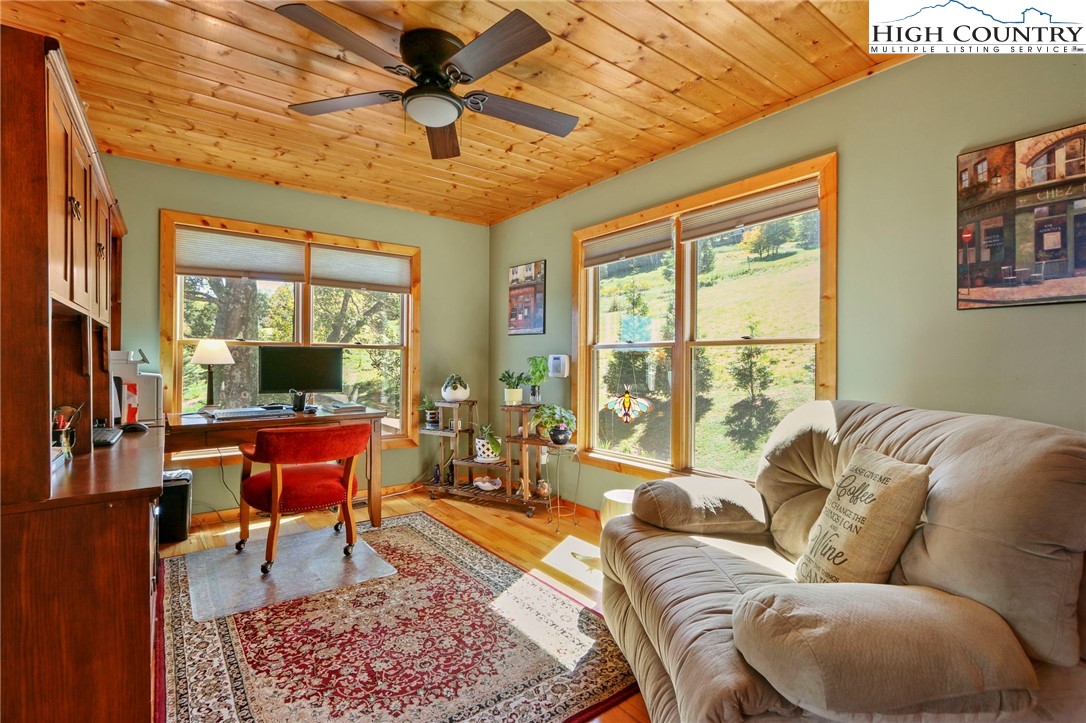 195 Omerta Lane Boone, NC 28607 - Photo 29 of 50 a living room with furniture a ceiling fan and a rug