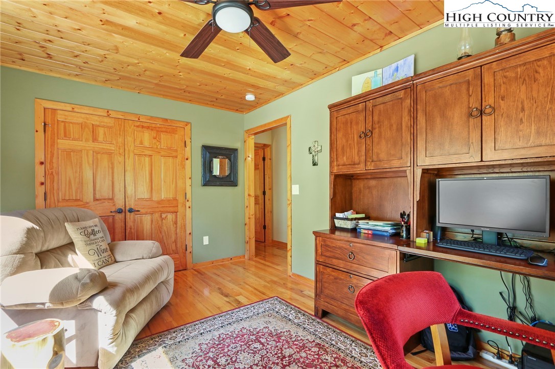 195 Omerta Lane Boone, NC 28607 - Photo 30 of 50 a living room with furniture a flat screen tv and kitchen view