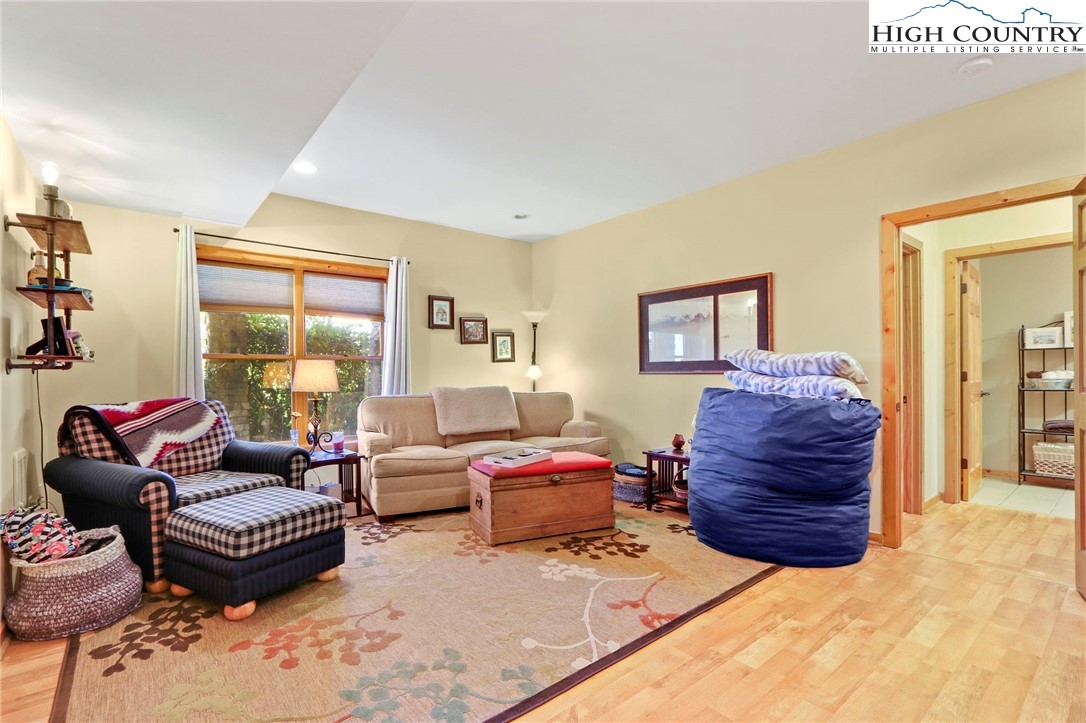 195 Omerta Lane Boone, NC 28607 - Photo 36 of 50 a living room with furniture a ceiling fan and a window